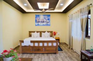 Ένα ή περισσότερα κρεβάτια σε δωμάτιο στο NT River View Homestay