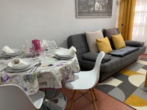 a living room with a table and a couch at La casita de Lukas in Sabero
