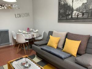 a living room with a couch and a table at La casita de Lukas in Sabero +43 photos