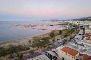an aerial view of a beach and buildings at Civitas Suites Hotel in Rethymno