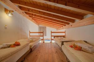 Postel nebo postele na pokoji v ubytování Hotel Relais Alpin