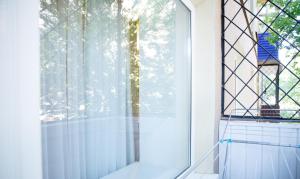 a glass window in a room with a window sill at APART-HOTEL VEGUS in Uralsk +64 photos