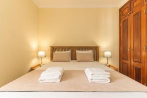 Postel nebo postele na pokoji v ubytování Santo Antonio View by Atlantic Holiday