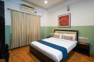 Ένα ή περισσότερα κρεβάτια σε δωμάτιο στο Olive Zip Rest House Road by Embassy Group +43 φωτογραφίες