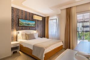 Postel nebo postele na pokoji v ubytování Nicholas Park Hotel + 17 fotografií