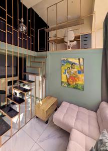 a living room with a couch and a table at memore in Mons