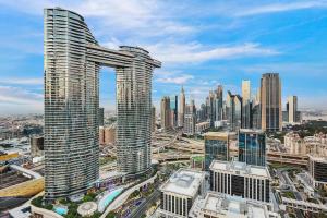 a view of a city skyline with tall buildings at Luxurious 3 BR with Burj Khalifa View in Downtown in Dubai