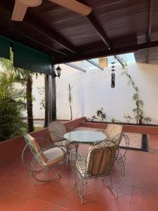 a patio with a table and chairs on a patio at Babella 2 in Concordia