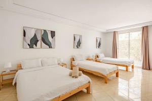 Postel nebo postele na pokoji v ubytování TT Holidays Hassan Tower 3Bedrooms