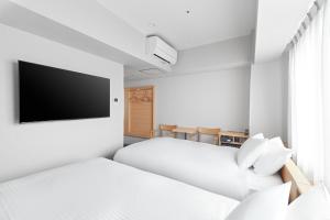 Postel nebo postele na pokoji v ubytování Sotetsu Fresa Inn Kyoto-Kiyomizu Gojo