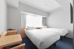 Postel nebo postele na pokoji v ubytování Sotetsu Fresa Inn Kyoto-Kiyomizu Gojo