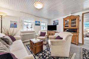 TV a/nebo společenská místnost v ubytování Ferienwohnung Timmermann 1