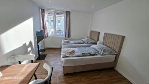 Ένα ή περισσότερα κρεβάτια σε δωμάτιο στο Moderne Apartments mit Klima, perfekter Anbindung ins Zentrum und kostenlose Parkplätze!