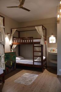 Ένα ή περισσότερα κρεβάτια σε δωμάτιο στο Vibes Inn Singing Tree +61 φωτογραφίες