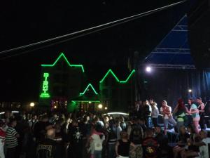 a crowd of people standing in a crowd at night at Hotel Restaurant Vizit in Truskavets +91 photos