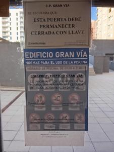 a sign that is on the side of a building at Palm Suites Gran Vía in Alicante +19 photos