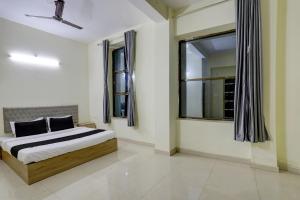 Ένα ή περισσότερα κρεβάτια σε δωμάτιο στο Hotel O Arena +22 φωτογραφίες