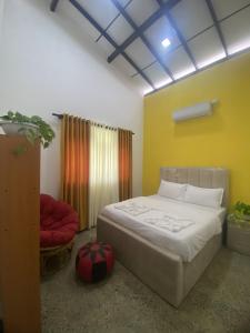 Ένα ή περισσότερα κρεβάτια σε δωμάτιο στο Villa Manthara