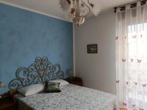 Ένα ή περισσότερα κρεβάτια σε δωμάτιο στο Casa Tatiana - Balangero