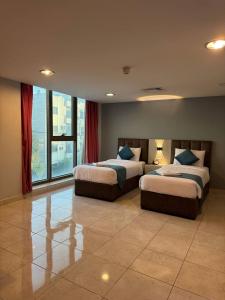 Una cama o camas en una habitación de al AMER palace hotel by al Jamal 3 fotos más