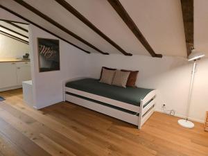 a bedroom with a bed in a attic at Charming Louisa Zimmer Roof - KEINE KÜCHE in Rueras