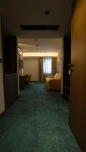 Ένα ή περισσότερα κρεβάτια σε δωμάτιο στο Hotel Central