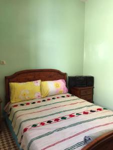 a bed in a room with at LoveWave House in Agadir +15 photos