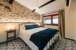 En eller flere senge i et værelse på Casa do Mao