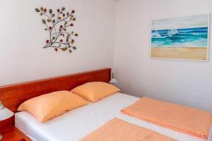 Postel nebo postele na pokoji v ubytování Apartments Luce