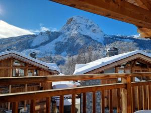 a view of a mountain from the deck of a cabin at Le Cochet by Lodji in Saint-Martin-de-Belleville