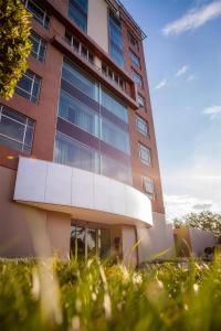 a tall building with a lot of windows at Southern Sun Rosebank, Johannesburg in Johannesburg