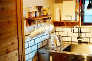 a kitchen with a sink and a counter top at Misorano Chalet in Hakuba +138 photos