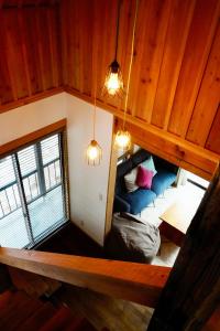 an overhead view of a room with a bed and lights at Misorano Chalet in Hakuba