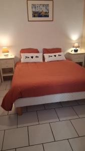 a bedroom with a bed with two pillows on it at La Bastide in Sanary-sur-Mer +21 photos