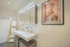 Koupelna v ubytování Luxury City Penthouse Villach + 30 fotografií