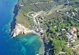 an aerial view of a village on a mountain near the ocean at Sansone Sul Mare Appartamenti in Portoferraio