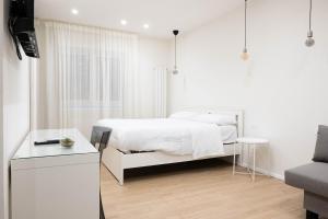 Ένα ή περισσότερα κρεβάτια σε δωμάτιο στο Happy Boutique Home Ercolano