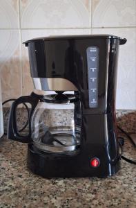 Příslušenství pro přípravu čaje a kávy v ubytování Relaxing and Serene Guest Room