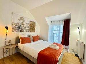 Postel nebo postele na pokoji v ubytování Maison Le A, à 2 pas de Disneyland