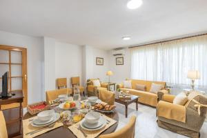 a living room with a couch and a table at Inspiration and Comfort near Pts and Fermasa in Armilla