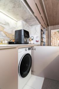 Køkken eller tekøkken på Experiência de Luxo Totalmente Climatizado e piscina