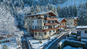 an aerial view of a hotel in the snow at Montana Apartments in Mayrhofen