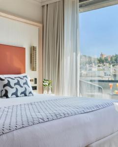 Postel nebo postele na pokoji v ubytování Barceló Carmen Granada