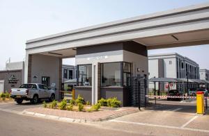 a car parked in front of a gas station at Reamo Suites in Gaborone