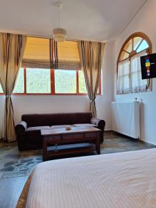 Giường trong phòng chung tại Villa Christina