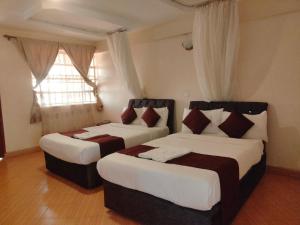 Ένα ή περισσότερα κρεβάτια σε δωμάτιο στο Dominion castle hotel