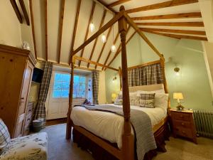 Ένα ή περισσότερα κρεβάτια σε δωμάτιο στο Guiting Guest House