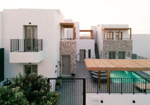 a view of a building with a wooden deck at Kalea Suites in Pollonia