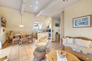 a living room with a couch and a table at Ferienwohnung Am Orpeturm in Marsberg