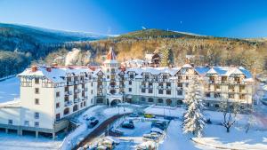 an aerial view of a hotel in the snow at Hotel Buczyński Medical & SPA in Świeradów-Zdrój
